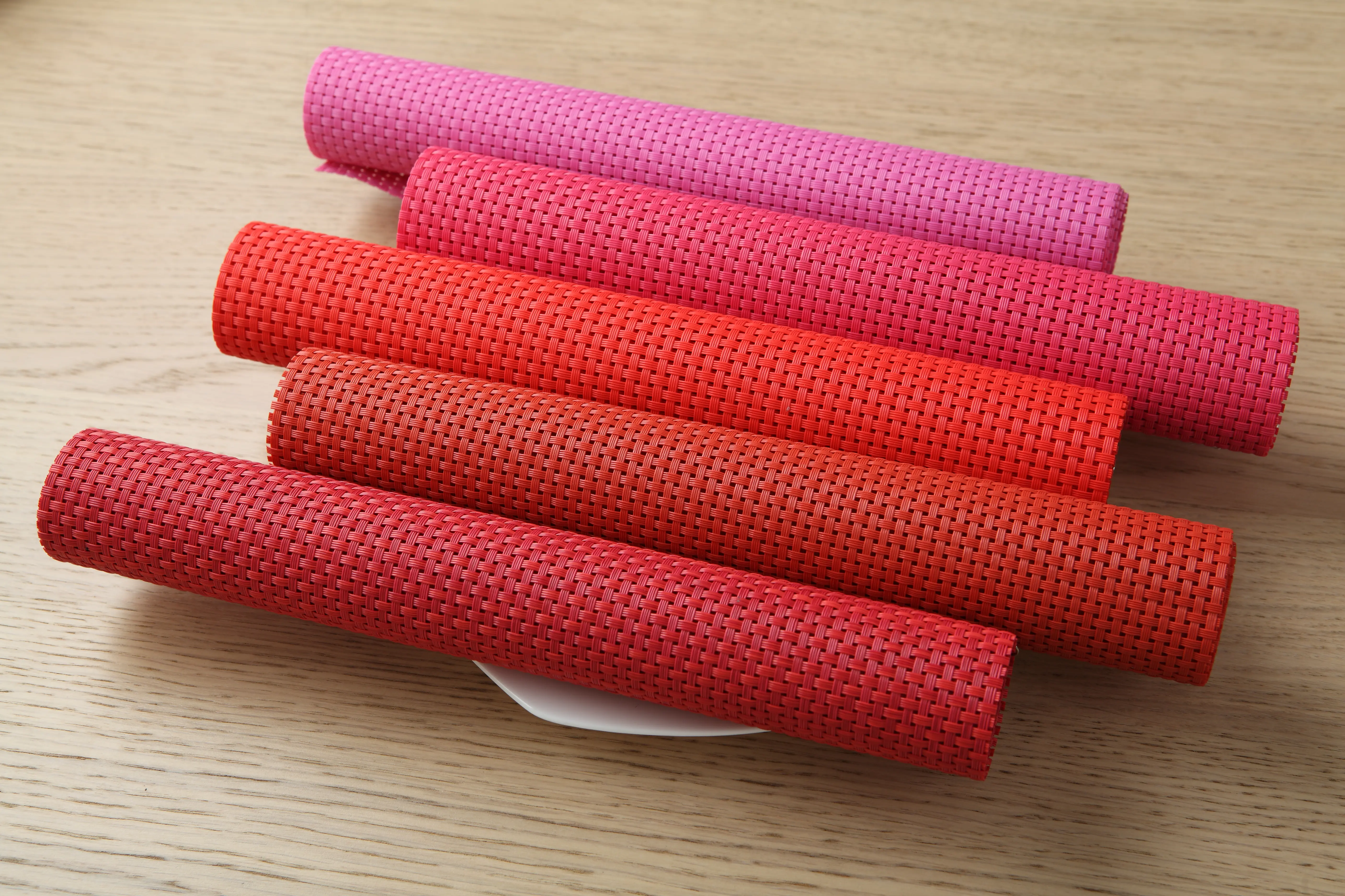 Woven mesh fabric for exterior roller shade applications